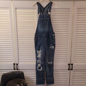 WOMEN'S AMERICAN EAGLE DISTRESSED OVERALL.